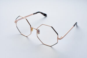 frame glasses epoka women polygonal shape metallic rose gold color grey details